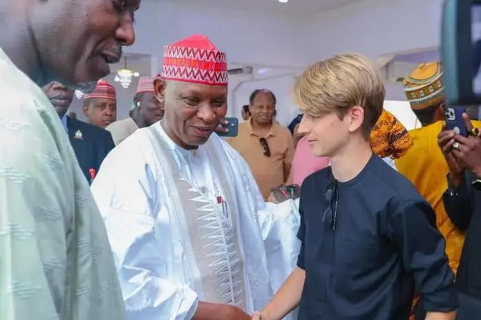 Gov Abba Kabir shaking hand with one of the specta Gov Abba Kabir shaking hand with one of the specta